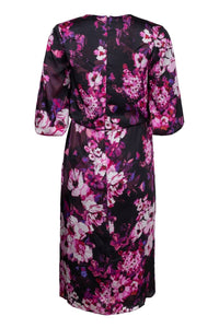 back view of Straight Dress with Draped Top and Billow Sleeves in a purple floral print with black background